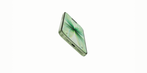 A green iPhone 17 is angled in profile, showcasing its sleek design and the vibrant green screen with abstract patterns