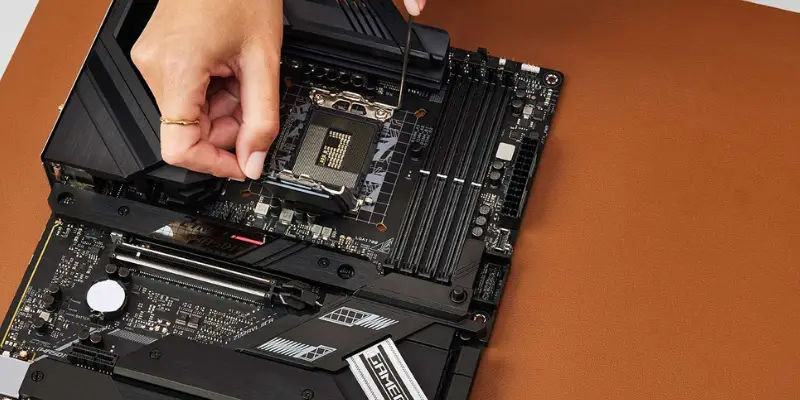 A Hand Lifting The Cpu Socket Retention Arm On A Motherboard Preparing To Install The Processor