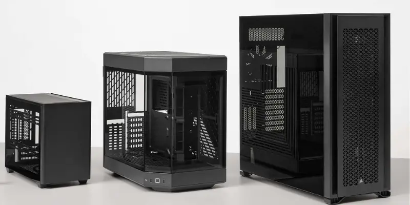 Three Modern Black Pc Cases Of Different Sizes Mini Itx Micro Atx And Mid Tower Shown Side By Side Illustrating Case Form Factors