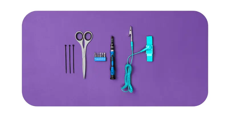 Tools For Pc Building Laid On A Purple Mat Three Black Zip Ties A Pair Of Scissors A Blue And Black At Bitbyteiq.com